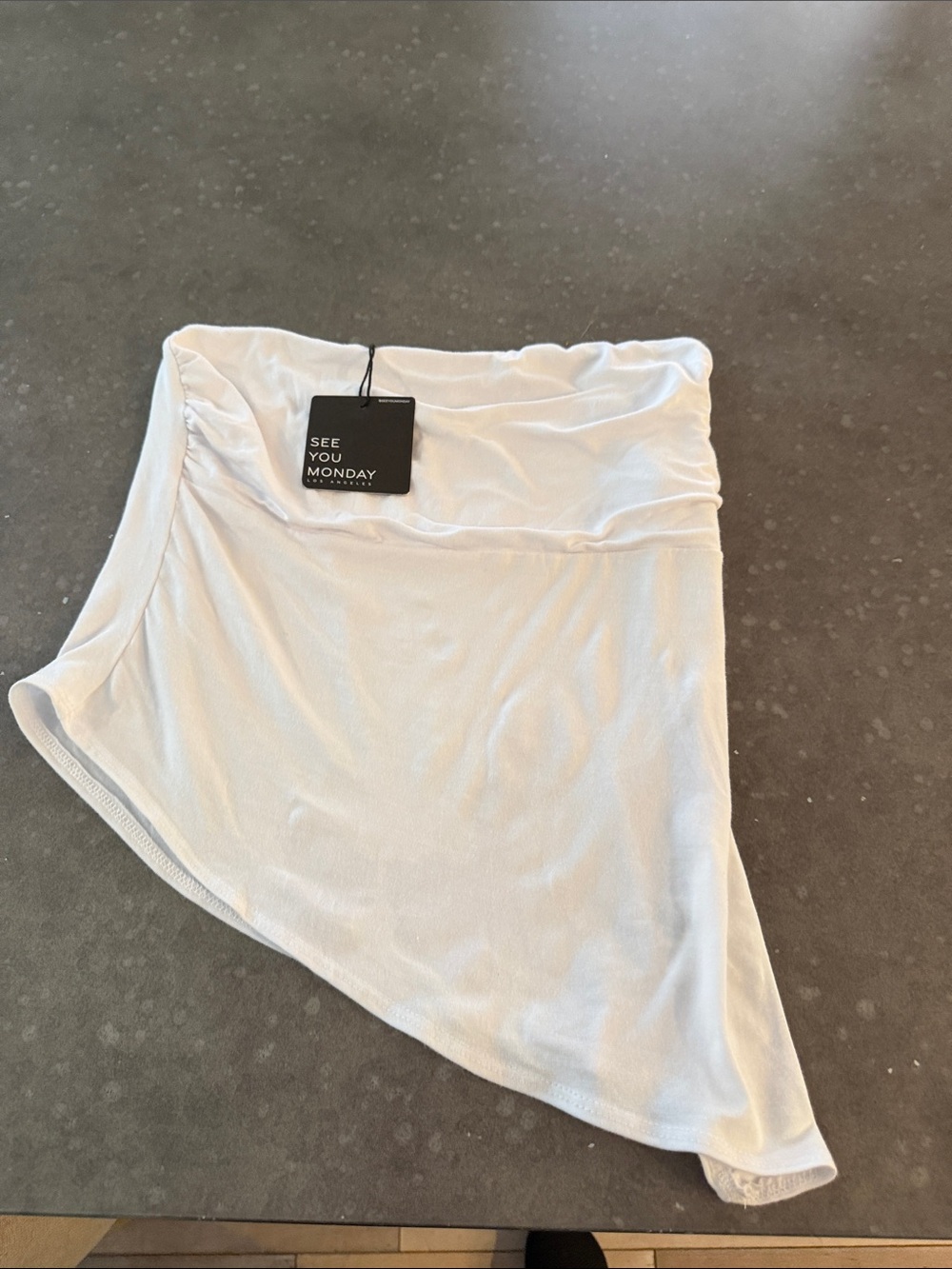 See You Monday White Asymmetrical Draped strapless top.